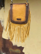 yellow fringed handbag