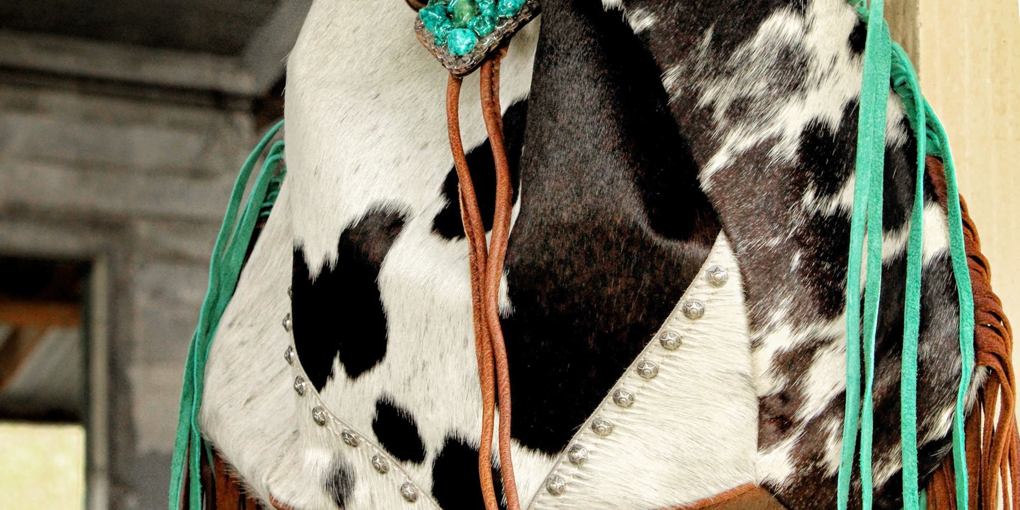 cow print fringed handbag